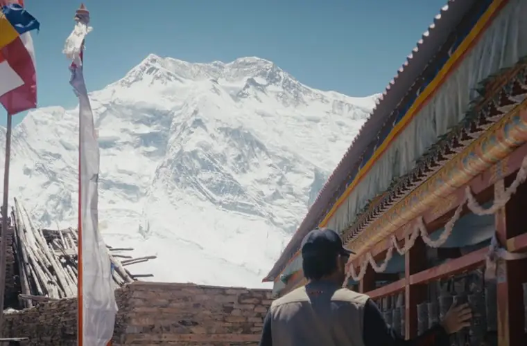 A mountain monastery and prayer flags